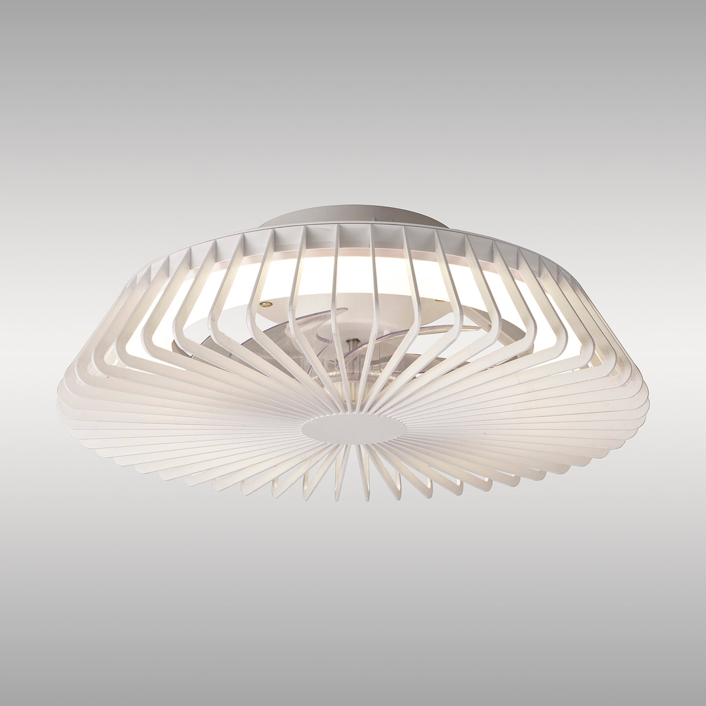 The Himalaya Mini White Ceiling Fan with Light by Ceiling Fans UK is a contemporary ceiling light fixture featuring a white, geometric, fan-like design. This 53cm fixture boasts a circular arrangement of slats radiating outward from the center for a modern appearance. It includes a 70W LED round ceiling light on a gradient light gray background and features a 30W DC reversible fan that is tuneable and comes with remote control and five years warranty.