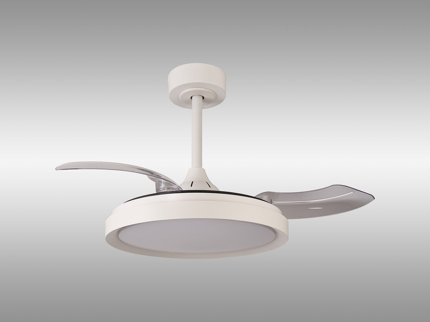 A Mistral Mini White Ceiling Fan with Light from Ceiling Fans UK is mounted against a grey gradient background. This modern fan features three transparent, retractable blades and a central circular light. It includes dimmable 40W LED lighting, a built-in 28W DC motor housed in a cylindrical casing, and is connected to the ceiling by a short downrod. For added convenience, it comes with a remote control and is backed by a 5-year warranty.