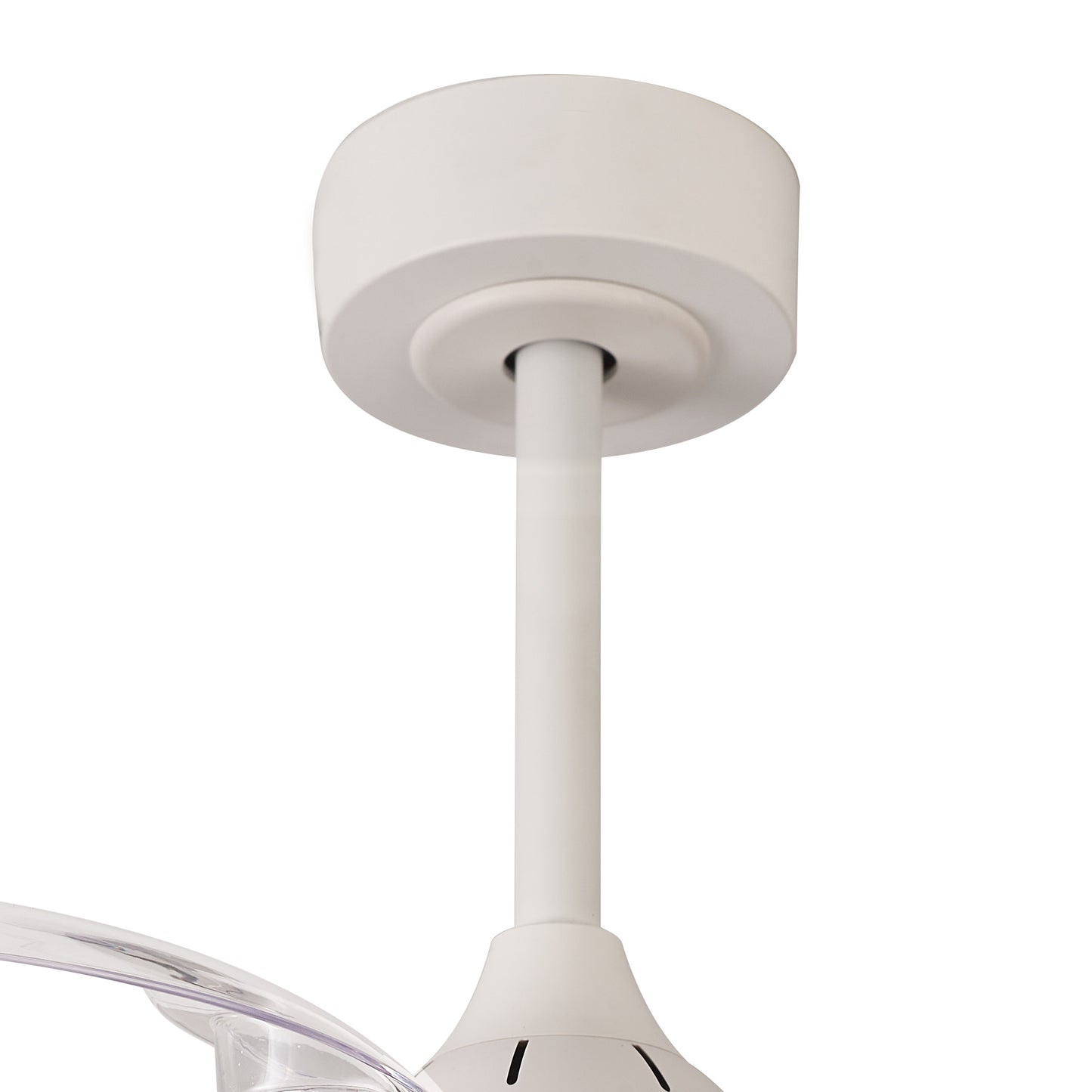 A close-up view of the Mistral Mini White Ceiling Fan with Light by Ceiling Fans UK shows the modern ceiling fan mount attached to the ceiling. The cylindrical base attaches to a straight rod connecting to the fan motor housing below. Part of a clear, curved fan blade is partially visible at the bottom left. This 40W LED dimmable ceiling light features built-in 28W DC fan and includes a remote control for ambiance control, along with a 5-year warranty.