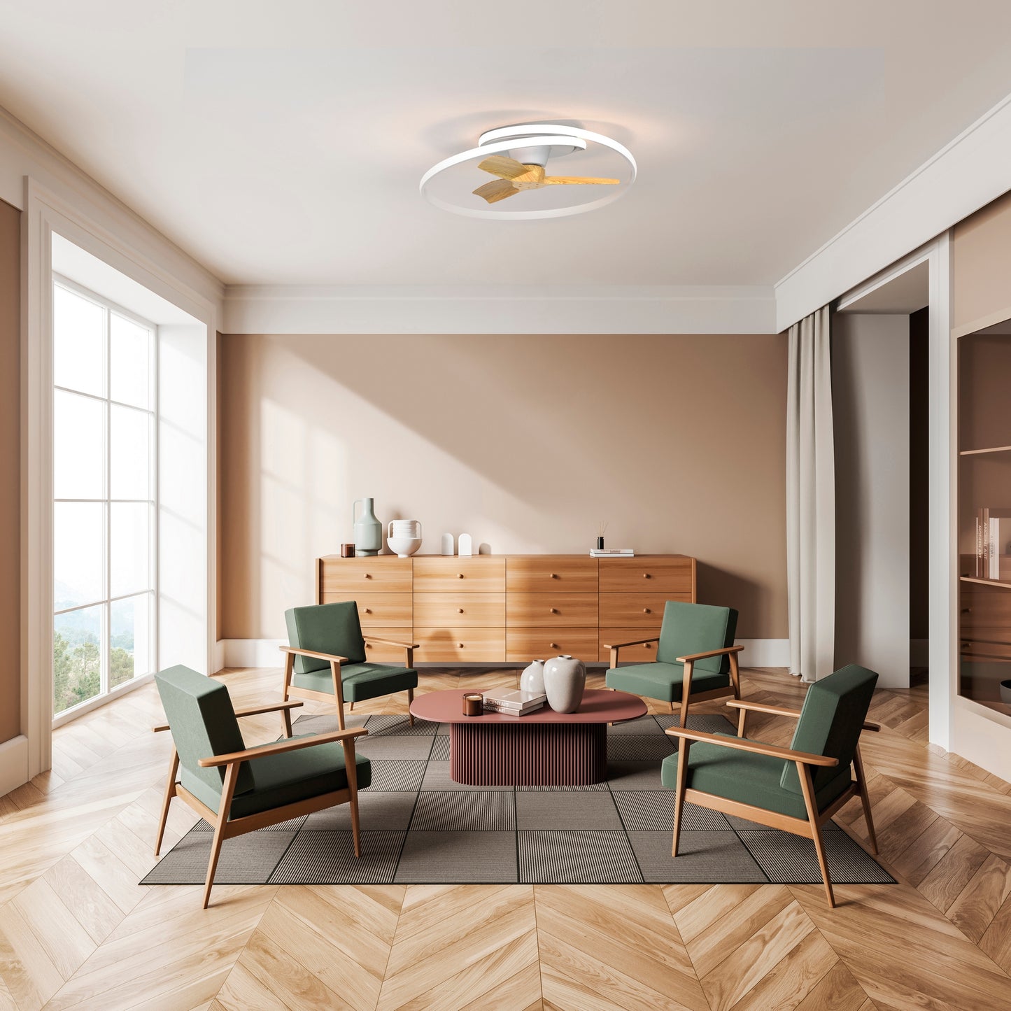 A modern living room features four green armchairs, a round coffee table, wooden sideboard, geometric rug, and large windows. The ambiance is set by the Ceiling Fans UK MANTRA M8235 Ocean White/Wood Dimmable LED Ceiling Fan with 5-year warranty.