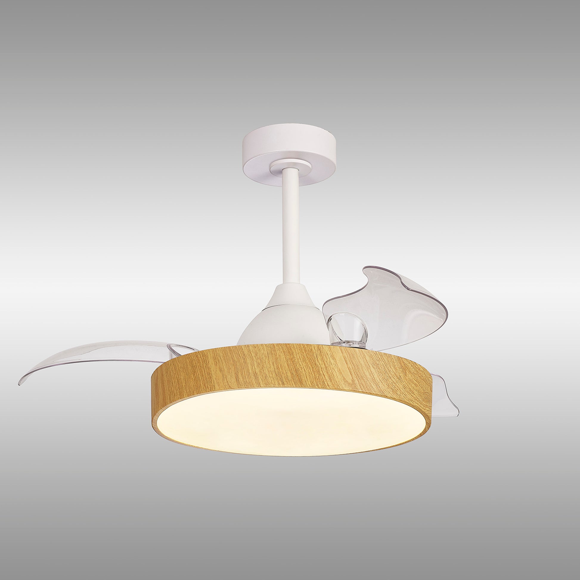 The Alaska Mini White/Wood Ceiling Fan with Light by Ceiling Fans UK features a sleek white support stem and a stylish cylindrical wooden lampshade, complemented by three translucent wing-shaped accents. The 43cm ceiling fan includes a powerful 45W LED dimmable ceiling light with a built-in 25W DC fan, offering the convenience of remote and APP control. It is mounted on a circular base set against a gradient of light to dark grey and comes with a 5-year warranty.