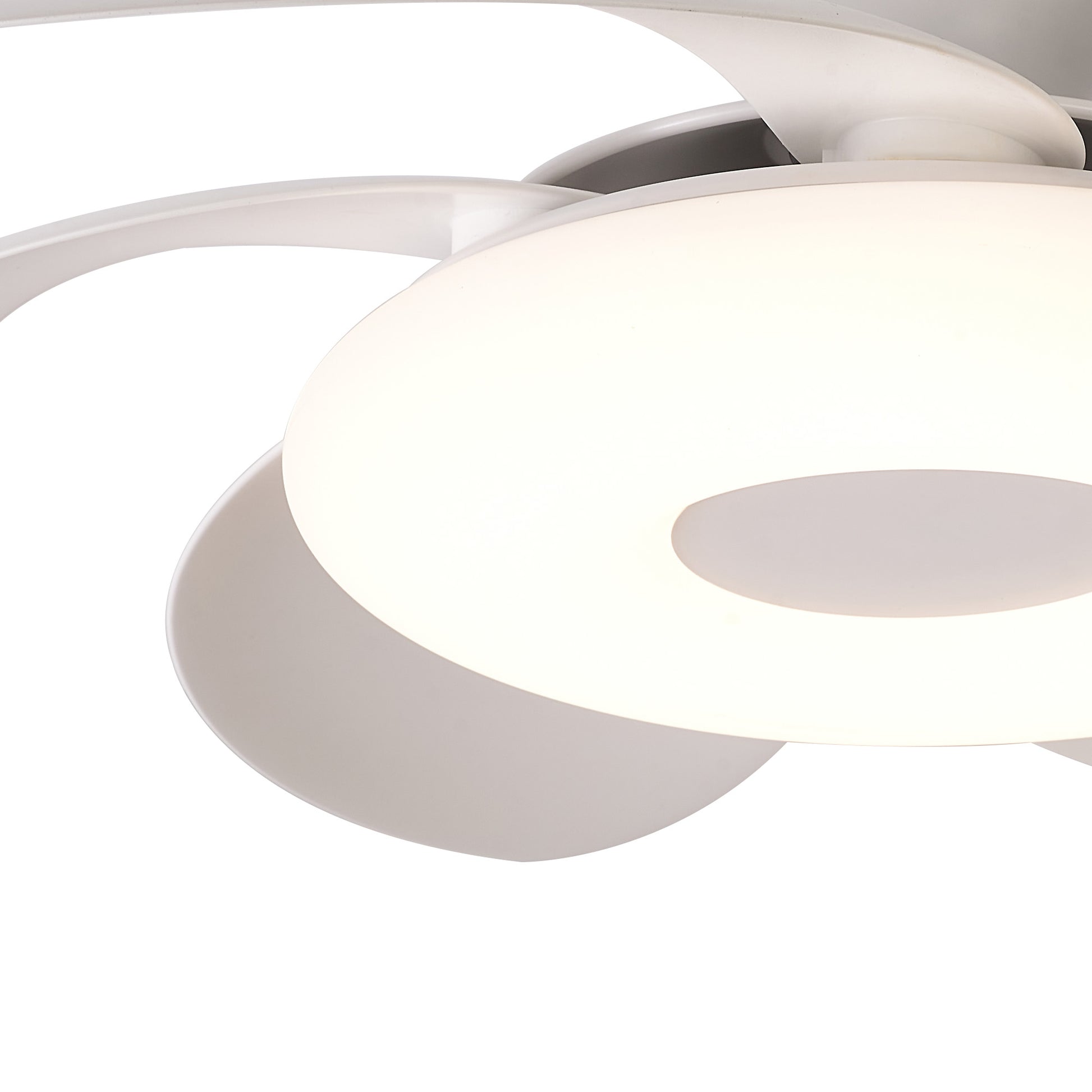 The Flower White Ceiling Fan with Light from Ceiling Fans UK, featuring a sleek, curved blade design and an integrated 24W circular, dimmable LED light fixture, is shown from a close-up angle. The 50cm fan's light fixture emits a soft, white glow and includes a built-in 25W DC reversible fan with remote control.